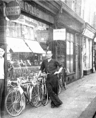 H E Green's shop in the 50s with H E Green centre and Pete Russell (?) in doorway