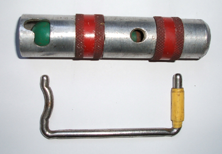 Image showing the component parts of the pump with the cylinder in situ. Here you can see the curve in the lever which fires the cylinder when the handle is turned