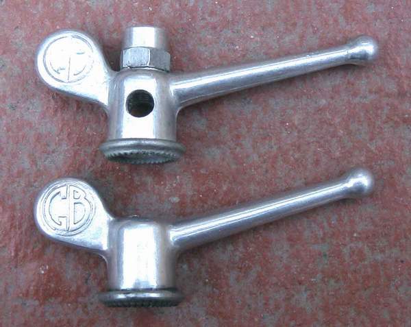 The wingnuts were available from 1949 The top one is for a Sturmey hub gear, note hole to check adjustment and extension to facilitate turn of toggle chain.