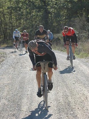 Luciano showing the way uphill on Strada Bianca. Single-speed 1930s machine See references to him