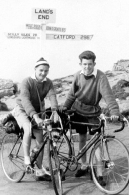 Two likely-lads( David Hinds and friend) pose at Land’s End Cornwall in the 1950s having toured with camping gear on a fixed wheel of about 64”
